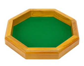 May include: Octagonal wooden dice tray with a green felt lining. The tray is made of light brown wood and has a smooth finish.