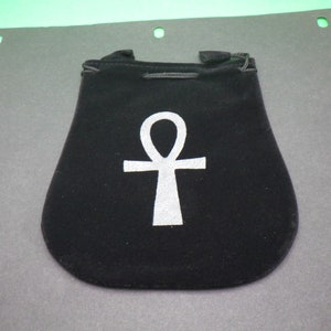 May include: Black velvet pouch with a silver Ankh symbol.