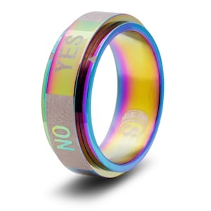 May include: A rainbow-colored metal ring with a spinning band that says "YES" on one side and "NO" on the other side.