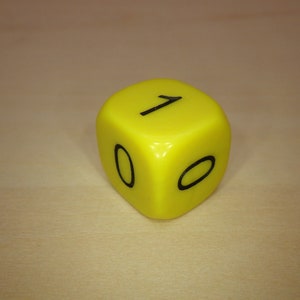 May include: A yellow plastic die with black numbers. The die shows the number 10.