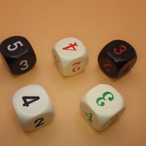 May include: Five dice, two white with black numbers, two black with white numbers, and one black with red numbers. The numbers on the dice are 2, 3, 4, and 5.