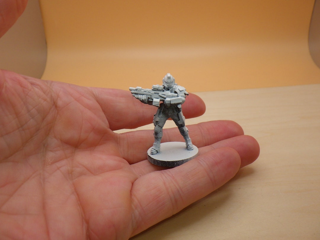 space-marine-in-armor-with-future-rifle-gun-blaster-figure-miniature