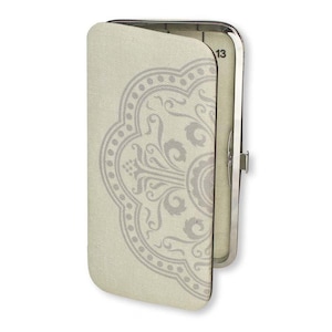 May include: A light beige clutch with a silver metal frame, partially open. The clutch features a gray floral pattern on the front. The number "13" is visible on the inside of the clutch.