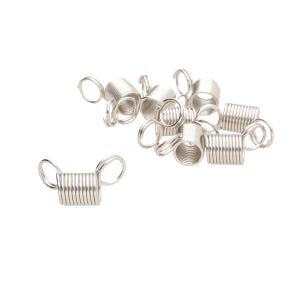 May include: A collection of silver-toned metal coil beads, each featuring a cylindrical spring-like body with a small circular loop attached to both ends. These metallic components are arranged in a loose cluster, showing a shiny finish.
