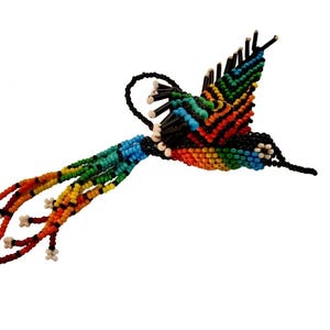 May include: A handcrafted hummingbird ornament made of colorful beads. The bird features a rainbow of colors, including blue, green, orange, and red, with a black body and tail. The hummingbird is designed with a curved beak and outstretched wings.
