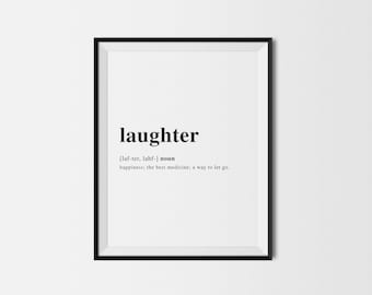 Puede incluir: Un marco negro que contiene una impresión blanca con la palabra "laughter" en negro. También se incluye la definición, la pronunciación y una explicación de su significado.