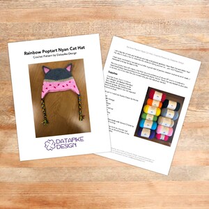 May include: Crochet pattern for a rainbow Poptart Nyan Cat hat. The pattern includes instructions and a list of supplies, including yarn colors. The pattern is by Datapike Design.