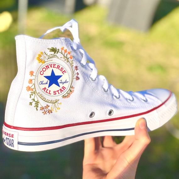 yellow converse with flowers