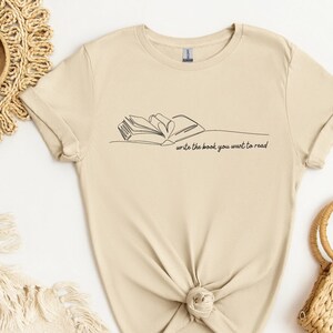 Schreibe das Buch, das du lesen möchtest Shirt, Bücherwurm Buch Shirt, Bibliothekar Geschenke, süßes grafisches T-Shirt, Inspiration Buch Shirt, Träumer Shirt