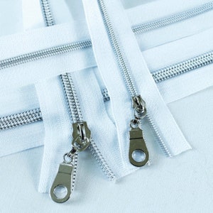 Size # 3 White Zipper with Silver Coil - 5 yards & 15 Regular (Donut) Zipper Pulls