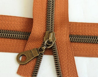 Size #5 Cinnamon Zipper with Antique Bronze coil - 5 yards & 15 Regular (Donut) Zipper Pulls