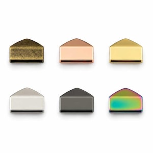 May include: A set of six metal cord ends with a pointed, house-shaped top and a rectangular opening at the base. The finishes include antique brass, rose gold, polished gold, silver, gunmetal grey, and a multi-colored iridescent rainbow finish.