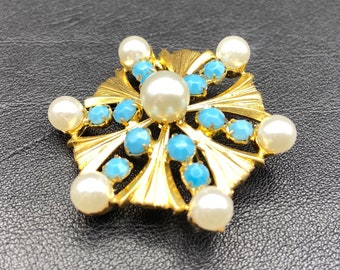 Broche vintage con cristales de cristal color turquesa con imitación de perlas.