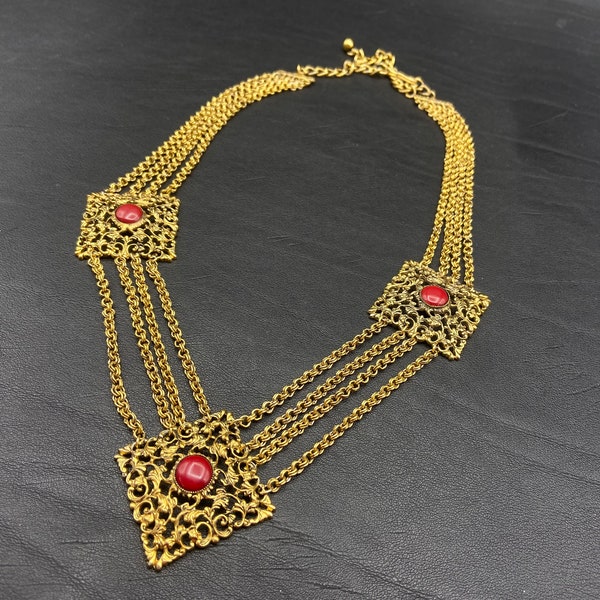 Vintage multi-chain festoon necklace. Connected to three square medallions set with red cabochons. Women's necklace.