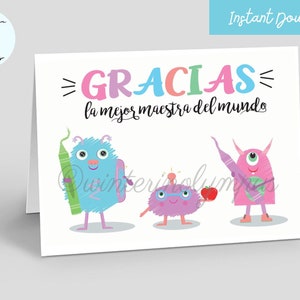 May include: A white card with the text "GRACIAS la mejor maestra del mundo" in colorful letters. Three cartoon monsters are holding school supplies. The monster on the left is blue and holding a green crayon. The monster in the middle is purple and holding a red apple. The monster on the right is pink and holding a purple pencil.