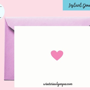 May include: A white card with a pink heart in the center. The card has the text "winterinolympus.com" at the bottom.