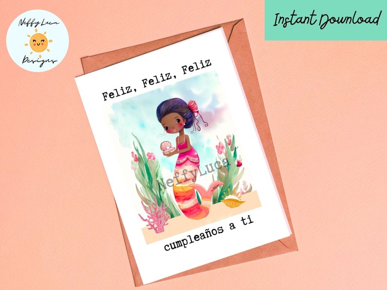 May include: A printable birthday card featuring a cartoon mermaid with brown skin and pink hair holding a pearl. The mermaid is surrounded by seaweed and coral. The card reads "Feliz, Feliz, Feliz cumplea&ntilde;os a ti".