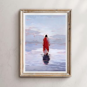May include: Framed art print showing a figure in a red robe walking on water. The artwork features a serene landscape with a light blue sky and water, and a golden frame.