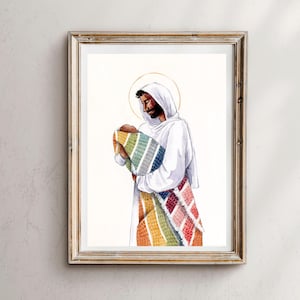 May include: Watercolor print in a gold frame. The artwork depicts a figure in white robes holding a baby wrapped in a colorful blanket. The blanket features a rainbow pattern. A gold halo is behind the figure's head.