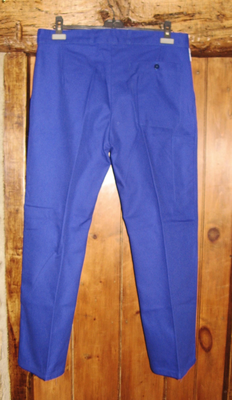 May include: A pair of blue pants with a back pocket.