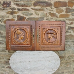 A Nice Pair Of Vintage French Oak Hand Carved Breton Cupboard Doors With  Breton Man And Woman  And Brass Key Escutcheons