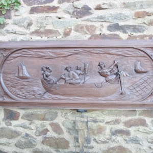 A Nice Vintage French Large Oak Hand Carved Breton Folk Art Wooden Panel Of Breton Men And Women Fishing In A Boat At Sea