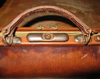 Lot 96 - A Large Leather Folding Gladstone Bag; Two