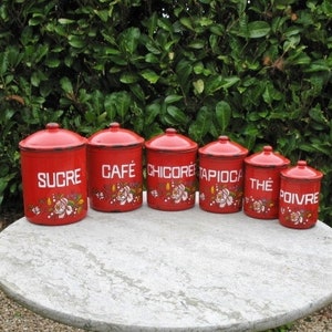 A Very Rare Graduated Red Enamel Six Piece Kitchen Canister Set With Raised Enamel Flowers And Contents Names From Early 1900s