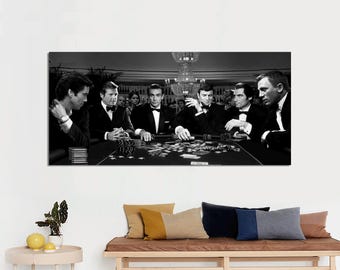 May include: Black and white photograph of six men sitting at a table playing cards. The men are wearing suits and ties. The table is covered in a green felt cloth. There are chips and cards on the table.