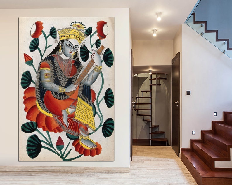 May include: A framed artwork depicting a seated figure playing a stringed instrument, surrounded by red and green floral elements. The figure is adorned in traditional attire with gold accents, set against a neutral background.