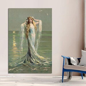 May include: A woman with long flowing hair and a white dress stands in the ocean. The water is a light blue and green color. The woman is surrounded by a halo of light.