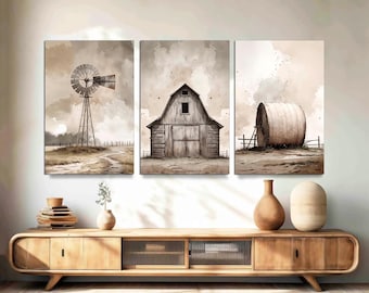 May include: A triptych of watercolor paintings depicting rural scenes. The panels show a windmill, a barn, and a hay bale. The artwork is rendered in muted earth tones, creating a rustic and serene aesthetic. The paintings are displayed above a wooden cabinet.