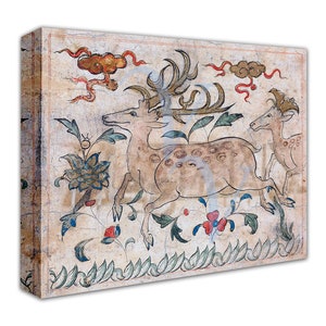 May include: A vintage-style painting of three deer in a forest setting. The deer are depicted in a light brown color with dark brown spots. The background features a light brown color with green and blue floral designs. The painting is framed in a light brown wood frame.