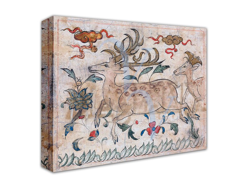 May include: A vintage-style painting of three deer in a forest setting. The deer are depicted in a light brown color with dark brown spots. The background features a light brown color with green and blue floral designs. The painting is framed in a light brown wood frame.