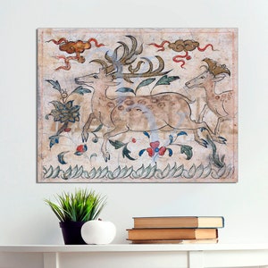 May include: A vintage illustration of three deer with spotted fur, surrounded by stylized flowers and leaves. The deer are depicted in a running pose, with their antlers raised. The background is a light beige with hints of red and blue.