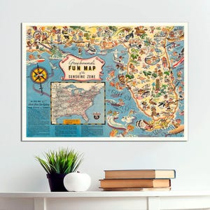 May include: A vintage illustrated map of the United States with a focus on the "Sunshine Zone" featuring a cartoon-style depiction of Florida and the Gulf of Mexico. The map is titled "Greyhound's Fun Map of the Sunshine Zone".