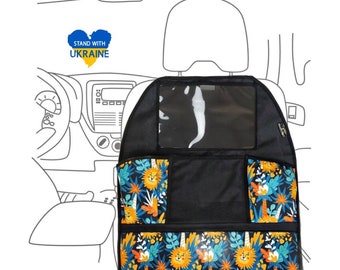 May include: Black car seat organizer with a clear plastic window, multiple pockets, and a colorful lion and palm tree print. The organizer has the text "Stand with Ukraine" in blue and yellow on a heart shape.