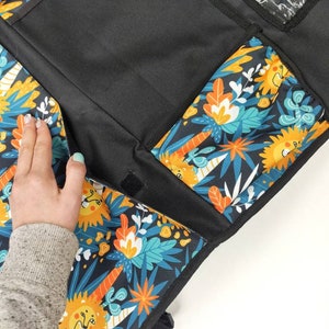 Roomy organizer in the car for trips with a child - 5 roomy pockets.
