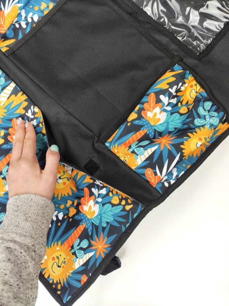 Roomy organizer in the car for trips with a child - 5 roomy pockets.