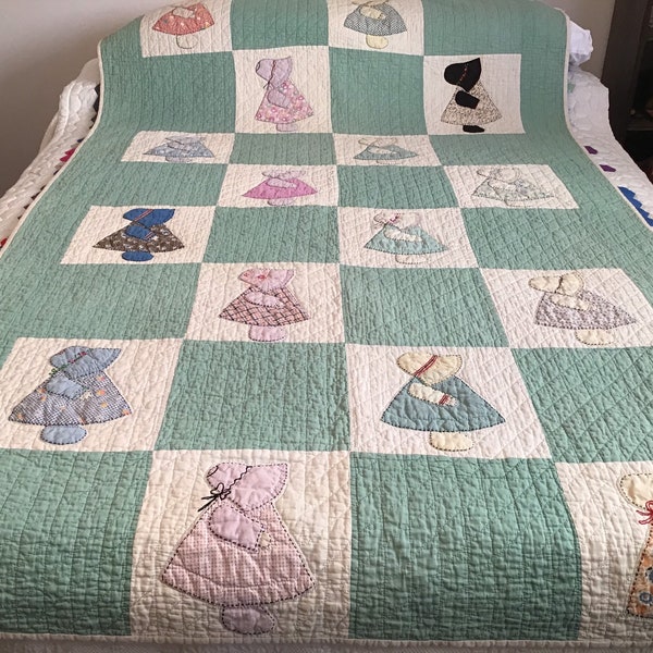 Beautiful, vintage, 1940s, hand pieced, hand appliquéd, hand embroidered, hand quilted, Sun Bonnet Sue quilt measuring 49” x 77”