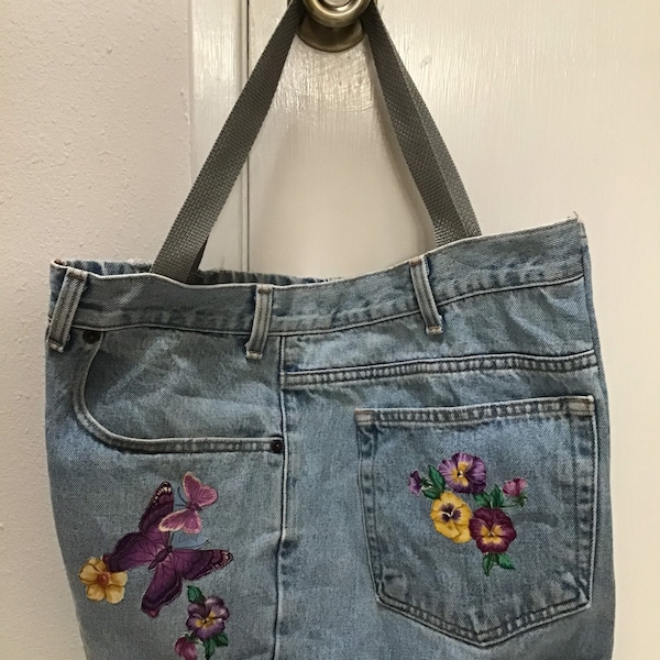 Pretty, sturdy, one of a kind, cloth/fabric iron on decal decorated, stone washed denim jean 14” - 16” shoulder tote