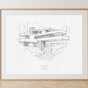Könnte beinhalten: Ein gerahmter schwarz-weißer Architektur-Druck von Fallingwater, einem Haus, das von Frank Lloyd Wright entworfen wurde. Der Druck zeigt das Haus mit einem Wasserfall und Bäumen. Der Text "FALLINGWATER" befindet sich unten.