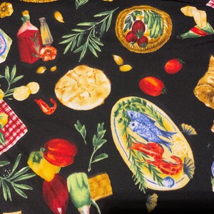 May include: Black fabric with a repeating pattern of Italian food illustrations. The design includes plates of pasta, fish, tomatoes, lemons, bread, olive branches, and bottles of oil and vinegar.