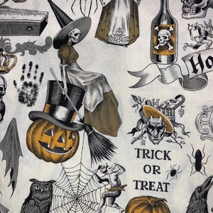 May include: A white fabric with a Halloween theme featuring a variety of illustrations including a witch, a spider, a pumpkin, a crow, a bottle, a skull, a clock, a handprint, a spiderweb, and the text "Trick or Treat".
