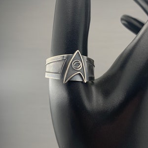 Sterling silver Trek Science Fleet ring with patina.  Size 8 and up available. Please specify size when ordering.