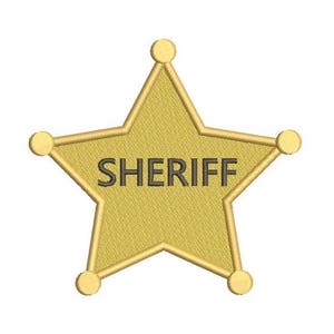 May include: A gold five-pointed star with rounded edges and a black outline. The word "SHERIFF" is printed in black letters on the star.