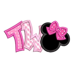 May include: Pink and white "TWO" with a pink bow on a black Minnie Mouse head.