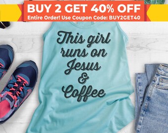 Puede incluir: Un top de tirantes azul claro con el texto "This girl runs on Jesus & Coffee" impreso en negro.