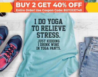 May include: A light blue tank top with a humorous saying: "I do yoga to relieve stress. Just kidding, I drink wine in yoga pants."