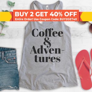 May include: Gray tank top with the text "Coffee & Adventures" in black lettering.